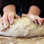 Image of kneeding bread dough at Food Sorcery Cookery School Didsbury, Manchester. Bread Making Class