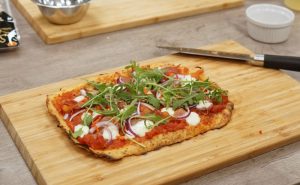 Muscle Gain Fit Food Class Cauliflower Pizza on chopping board At Food Sorcery Didsbury