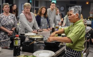 image of people listerning to hands chefs table Chochaba Harper Thai Chef cookery class things to do manchester