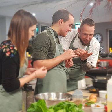 image of people attending a cookery lesson at the cookery school manchester near wilmslow cheshire