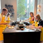 image of guests cooking at Food Sorcery Cookery school Manchester