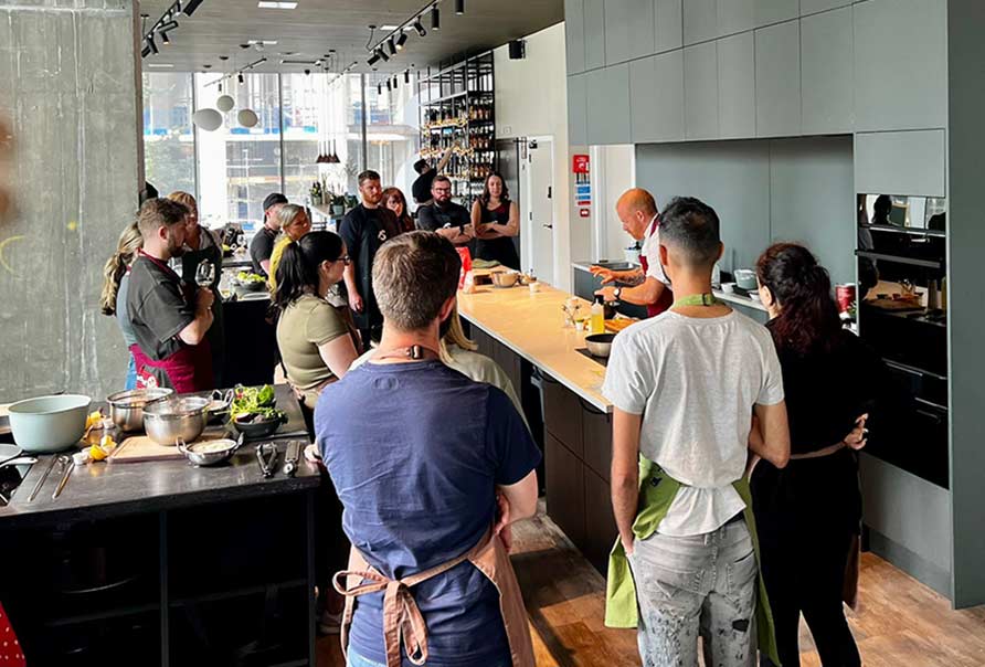 image of guests cooking at Food Sorcery Cookery school Manchester